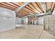 Unfinished basement with concrete floors and exposed beam ceilings provides an opportunity to personalize at 3325 Umber Cir, Castle Rock, CO 80109