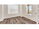 Inviting room featuring modern wood flooring, a window, and a bright and airy atmosphere at 3325 Umber Cir, Castle Rock, CO 80109