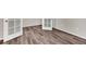 Bright bedroom featuring stylish wood-look flooring and modern white doors at 3325 Umber Cir, Castle Rock, CO 80109