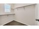 Walk-in closet features carpeted floors, a window and metal shelving for optimal storage solutions at 3325 Umber Cir, Castle Rock, CO 80109