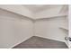Walk-in closet with neutral walls, carpeted flooring and shelving at 3325 Umber Cir, Castle Rock, CO 80109