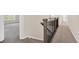Hallway stairs featuring neutral colored carpet, classic railing and natural light at 3325 Umber Cir, Castle Rock, CO 80109