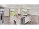 Open kitchen showcasing a large island with granite countertop and stainless steel dishwasher at 3325 Umber Cir, Castle Rock, CO 80109