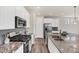 Gourmet kitchen featuring stainless steel appliances and a granite-topped center island at 3325 Umber Cir, Castle Rock, CO 80109