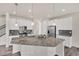 Modern kitchen featuring stainless steel appliances, granite countertops, and ample cabinet space at 3325 Umber Cir, Castle Rock, CO 80109