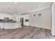 Spacious living area with lots of natural light streaming through the windows, next to the kitchen at 3325 Umber Cir, Castle Rock, CO 80109