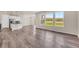 Bright, open-concept living room with hardwood floors and large windows offering scenic views at 3325 Umber Cir, Castle Rock, CO 80109