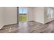 Bright living room featuring a sliding glass door leading to the backyard at 3325 Umber Cir, Castle Rock, CO 80109