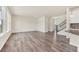 Open living space with hardwood floors, seamlessly connecting to the kitchen and dining areas at 3325 Umber Cir, Castle Rock, CO 80109