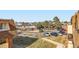 Apartment view overlooks community parking lot and landscaping at 10211 Ura Ln # 304, Thornton, CO 80260
