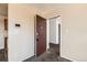 Entryway view with carpet flooring, a security system and a glimpse into another room at 10211 Ura Ln # 304, Thornton, CO 80260