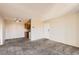 Inviting living room with neutral walls and plush carpeting, plus a ceiling fan at 10211 Ura Ln # 304, Thornton, CO 80260