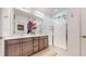 Elegant bathroom with double vanity, a glass-enclosed shower, and modern fixtures at 9264 Sedalia St, Commerce City, CO 80022