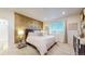 Cozy main bedroom featuring decorative accent wall, plush carpeting, and a bright window at 9264 Sedalia St, Commerce City, CO 80022