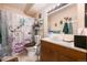 Full bathroom with wood vanity, shower/tub combination, and tiled floor at 650 S Clinton St # 11B, Denver, CO 80247