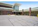 Building with brick columns, multiple businesses and yellow pylons at 650 S Clinton St # 11B, Denver, CO 80247