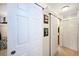 Hallway with closets featuring white doors and wood trim at 650 S Clinton St # 11B, Denver, CO 80247
