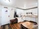 Eat-in kitchen with white cabinets, granite countertops, and stainless appliances at 650 S Clinton St # 11B, Denver, CO 80247