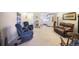 Open-concept living room with a kitchen, comfortable seating, and neutral decor at 650 S Clinton St # 11B, Denver, CO 80247
