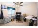 Dedicated home office featuring a ceiling fan, large desk area, and natural light at 650 S Clinton St # 11B, Denver, CO 80247