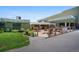 Outdoor seating area with a wooden deck and lush landscaping surrounding at 650 S Clinton St # 11B, Denver, CO 80247