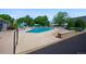 Outdoor pool with lounge chairs and umbrellas at 650 S Clinton St # 11B, Denver, CO 80247