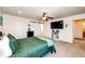 Bright bedroom with a ceiling fan, large bed, and a window at 2091 Basil St, Strasburg, CO 80136