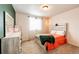 Comfortable bedroom featuring a large window that offers plenty of natural light at 2091 Basil St, Strasburg, CO 80136