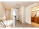 Hallway features carpeted floors, neutral walls, and access to bathroom and bedroom at 2091 Basil St, Strasburg, CO 80136