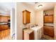Laundry room equipped with appliances and storage cabinets at 2091 Basil St, Strasburg, CO 80136
