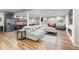 Finished basement with a kitchenette, bar area, comfortable seating, and a wall-mounted TV at 6040 Virgil St, Arvada, CO 80403