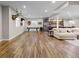 Expansive basement with wood flooring, a pool table, kitchenette, and comfortable seating area at 6040 Virgil St, Arvada, CO 80403