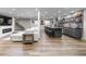 Spacious finished basement with bar, fireplace, and entertainment area, perfect for gatherings and recreation at 6040 Virgil St, Arvada, CO 80403