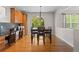 Inviting dining area with a wooden table set, hardwood floors, and built-in desk at 6040 Virgil St, Arvada, CO 80403