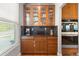 Kitchen with glass-front cabinets, granite countertops, stainless steel appliances, and built-in oven at 6040 Virgil St, Arvada, CO 80403