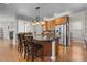 Spacious kitchen with a large island, stainless steel appliances, and ample counter space for cooking at 6040 Virgil St, Arvada, CO 80403