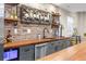 Stylish basement kitchenette with custom cabinets, wood countertop, backsplash, and open shelving at 6040 Virgil St, Arvada, CO 80403