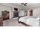 Serene main bedroom with a fireplace, TV, and neutral color palette, creating a cozy retreat at 6040 Virgil St, Arvada, CO 80403