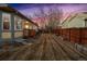 Back exterior view with a large brown yard and a wooden fence in the background at 12776 Yates Cir, Broomfield, CO 80020