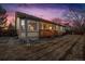 Back exterior view featuring a raised wooden deck and a large grassy yard at 12776 Yates Cir, Broomfield, CO 80020