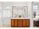 Bright bathroom with double sink vanity and a large mirror at 12776 Yates Cir, Broomfield, CO 80020