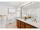 Bathroom with double sink vanity and decorative lighting at 12776 Yates Cir, Broomfield, CO 80020