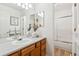 Bathroom with a wooden cabinet sink, two mirrors, and a glass shower at 12776 Yates Cir, Broomfield, CO 80020