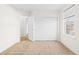 Bright bedroom with carpet, closet, window with blinds, and entry to another room at 12776 Yates Cir, Broomfield, CO 80020