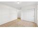 Carpeted bedroom with white walls, a ceiling light, and a closet with sliding doors at 12776 Yates Cir, Broomfield, CO 80020