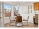 Bright breakfast nook featuring large windows, modern table set, and stylish decor at 12776 Yates Cir, Broomfield, CO 80020