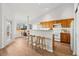 Bright kitchen and breakfast nook with wood cabinets, modern appliances, and sunny windows at 12776 Yates Cir, Broomfield, CO 80020