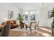 Bright and airy living room with large windows, modern furnishings, and stylish decor at 12776 Yates Cir, Broomfield, CO 80020