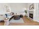 Cozy living room featuring a fireplace, modern furnishings, and ample natural light at 12776 Yates Cir, Broomfield, CO 80020