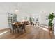 Open living room with vaulted ceilings, wood floors, and large windows for natural light at 12776 Yates Cir, Broomfield, CO 80020